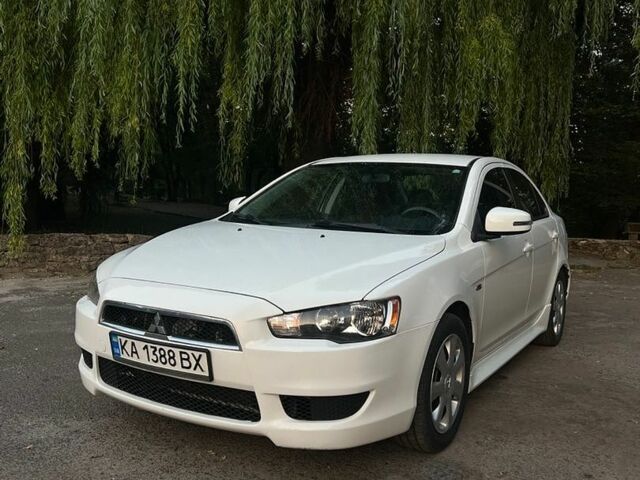 Білий Міцубісі Lancer, об'ємом двигуна 2 л та пробігом 230 тис. км за 8600 $, фото 1 на Automoto.ua