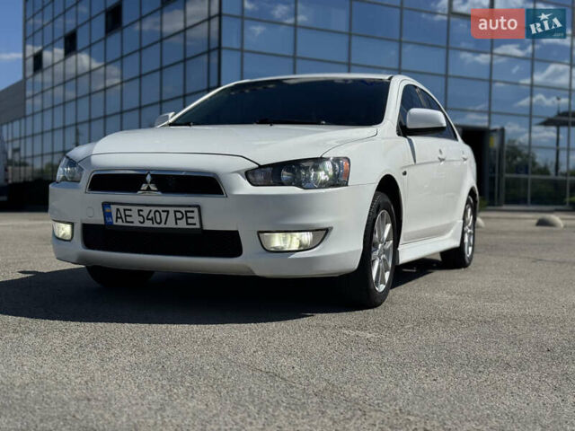 Білий Міцубісі Lancer, об'ємом двигуна 2 л та пробігом 165 тис. км за 8999 $, фото 1 на Automoto.ua