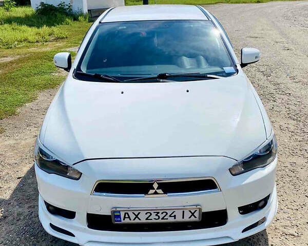 Белый Мицубиси Лансер, объемом двигателя 2 л и пробегом 150 тыс. км за 7690 $, фото 1 на Automoto.ua