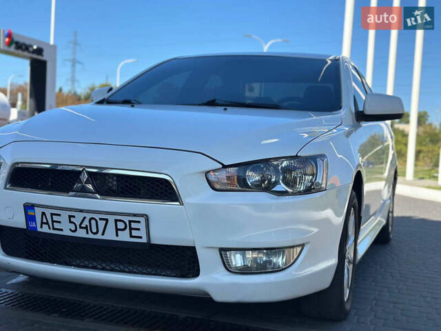 Білий Міцубісі Lancer, об'ємом двигуна 2 л та пробігом 165 тис. км за 7899 $, фото 1 на Automoto.ua