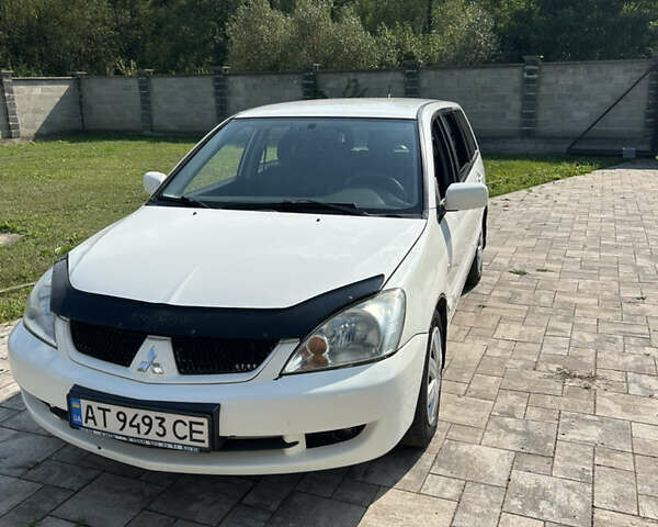 Білий Міцубісі Lancer, об'ємом двигуна 1.6 л та пробігом 147 тис. км за 3100 $, фото 1 на Automoto.ua