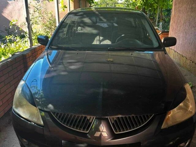 Чорний Міцубісі Lancer, об'ємом двигуна 1.6 л та пробігом 200 тис. км за 2900 $, фото 1 на Automoto.ua