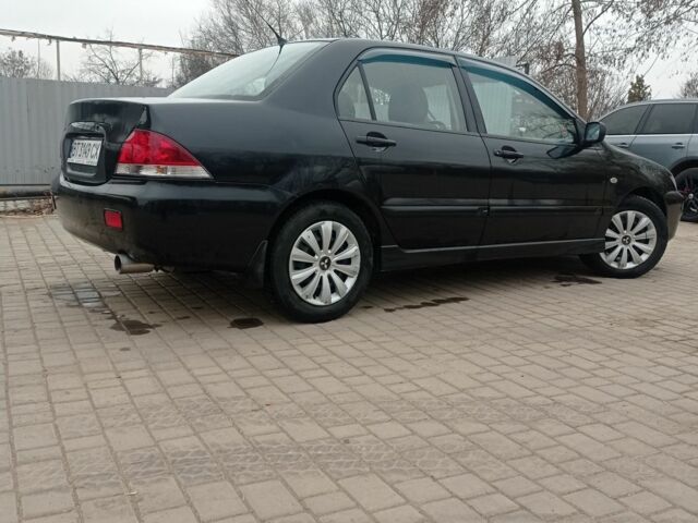 Черный Мицубиси Лансер, объемом двигателя 1.6 л и пробегом 360 тыс. км за 3800 $, фото 1 на Automoto.ua