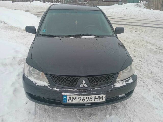 Черный Мицубиси Лансер, объемом двигателя 1.6 л и пробегом 290 тыс. км за 3950 $, фото 1 на Automoto.ua