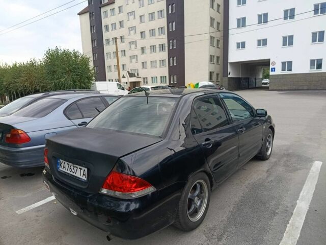 Чорний Міцубісі Lancer, об'ємом двигуна 1.6 л та пробігом 260 тис. км за 2706 $, фото 1 на Automoto.ua