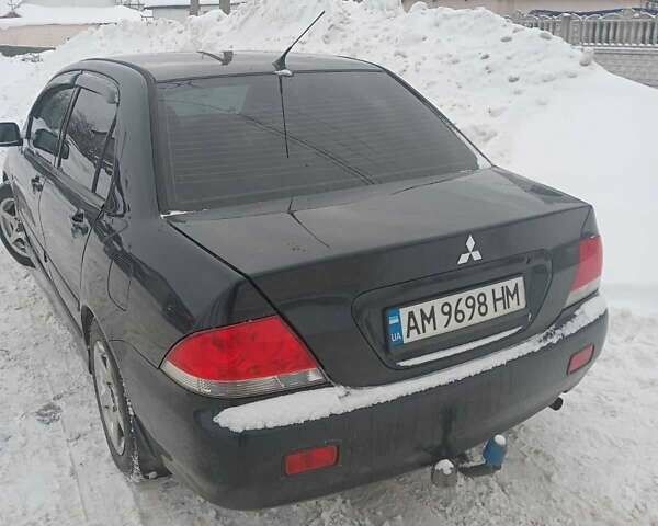 Черный Мицубиси Лансер, объемом двигателя 1.6 л и пробегом 290 тыс. км за 3950 $, фото 1 на Automoto.ua