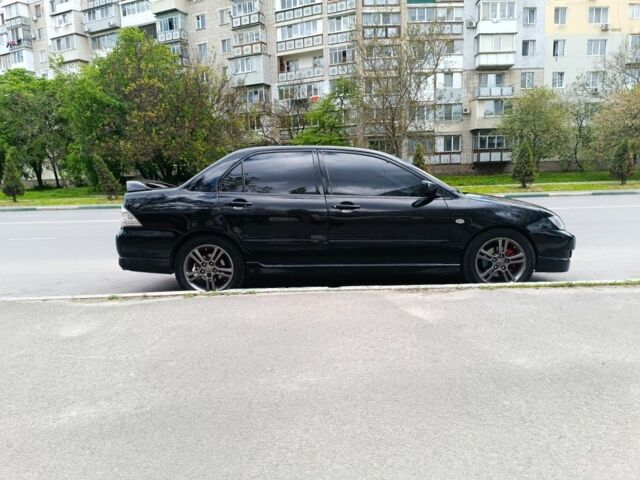 Чорний Міцубісі Lancer, об'ємом двигуна 2 л та пробігом 270 тис. км за 5000 $, фото 1 на Automoto.ua
