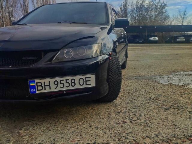 Черный Мицубиси Лансер, объемом двигателя 2 л и пробегом 161 тыс. км за 3999 $, фото 1 на Automoto.ua