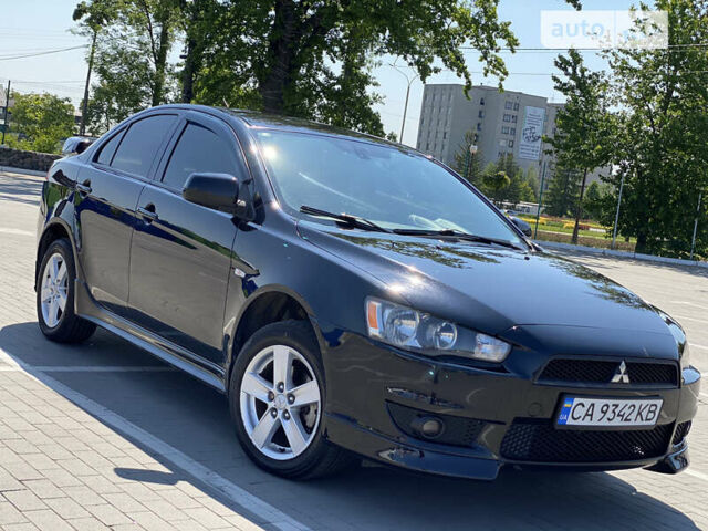 Чорний Міцубісі Lancer, об'ємом двигуна 2 л та пробігом 170 тис. км за 7000 $, фото 1 на Automoto.ua