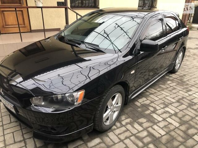 Чорний Міцубісі Lancer, об'ємом двигуна 1.8 л та пробігом 141 тис. км за 8700 $, фото 1 на Automoto.ua