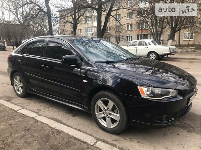 Чорний Міцубісі Lancer, об'ємом двигуна 1.8 л та пробігом 130 тис. км за 8000 $, фото 1 на Automoto.ua