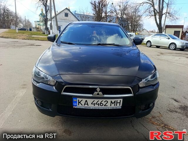 Черный Мицубиси Лансер, объемом двигателя 2 л и пробегом 279 тыс. км за 6200 $, фото 1 на Automoto.ua