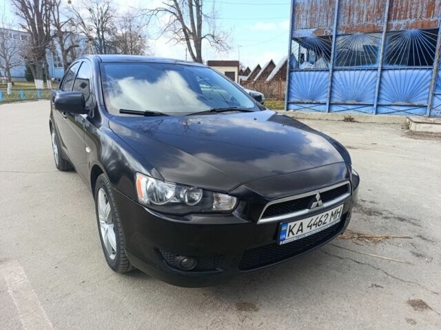 Черный Мицубиси Лансер, объемом двигателя 2 л и пробегом 279 тыс. км за 6200 $, фото 1 на Automoto.ua