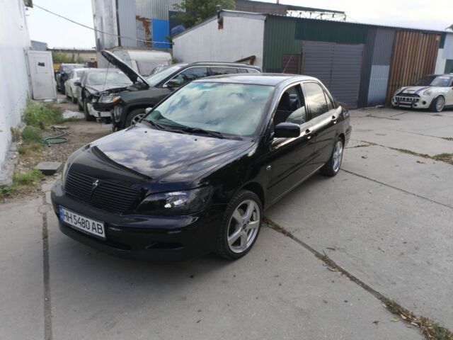 Чорний Міцубісі Lancer, об'ємом двигуна 2 л та пробігом 270 тис. км за 3800 $, фото 1 на Automoto.ua