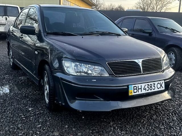 Чорний Міцубісі Lancer, об'ємом двигуна 2 л та пробігом 1850 тис. км за 2700 $, фото 1 на Automoto.ua