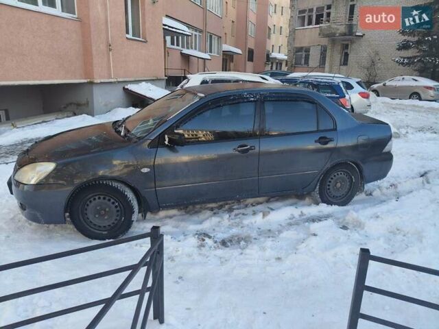 Черный Мицубиси Лансер, объемом двигателя 1.58 л и пробегом 275 тыс. км за 2900 $, фото 1 на Automoto.ua