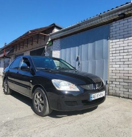 Черный Мицубиси Лансер, объемом двигателя 1.6 л и пробегом 200 тыс. км за 3499 $, фото 1 на Automoto.ua