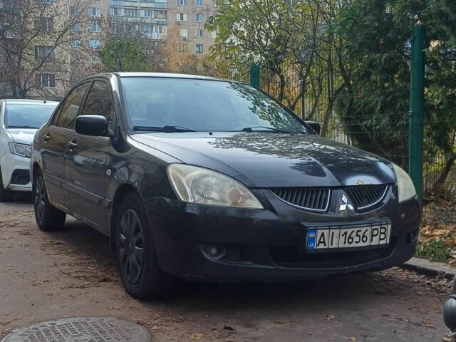 Черный Мицубиси Лансер, объемом двигателя 1.6 л и пробегом 218 тыс. км за 3200 $, фото 1 на Automoto.ua