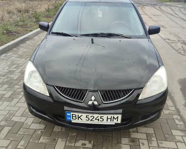 Чорний Міцубісі Lancer, об'ємом двигуна 1.58 л та пробігом 278 тис. км за 3700 $, фото 1 на Automoto.ua