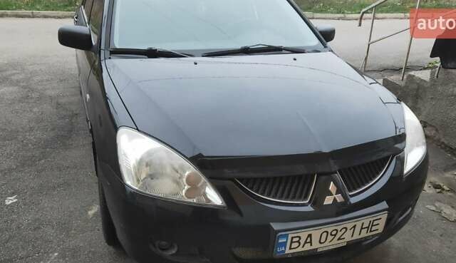 Черный Мицубиси Лансер, объемом двигателя 1.58 л и пробегом 240 тыс. км за 3700 $, фото 1 на Automoto.ua