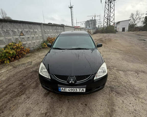 Черный Мицубиси Лансер, объемом двигателя 1.58 л и пробегом 229 тыс. км за 3700 $, фото 1 на Automoto.ua