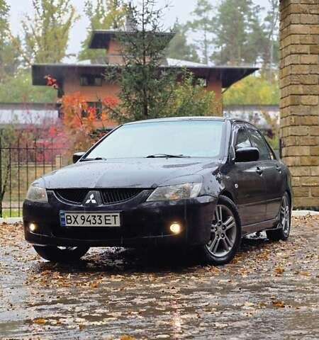 Чорний Міцубісі Lancer, об'ємом двигуна 2 л та пробігом 320 тис. км за 5700 $, фото 1 на Automoto.ua