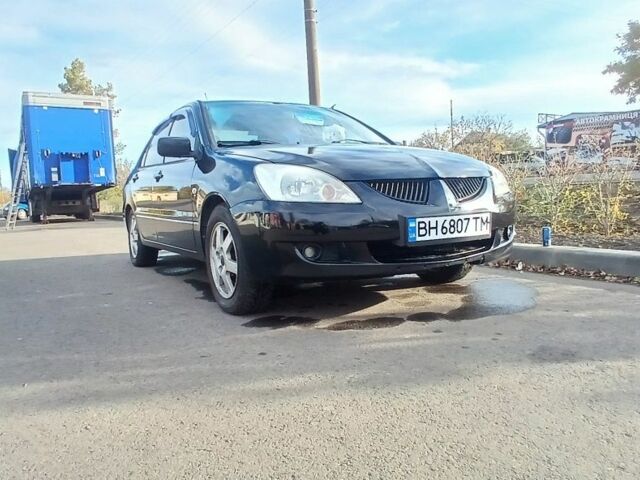 Чорний Міцубісі Lancer, об'ємом двигуна 1.6 л та пробігом 178 тис. км за 2616 $, фото 1 на Automoto.ua