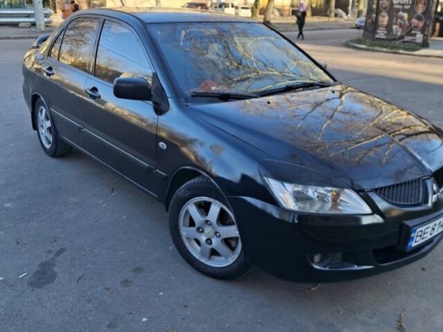 Черный Мицубиси Лансер, объемом двигателя 1.6 л и пробегом 230 тыс. км за 3300 $, фото 1 на Automoto.ua