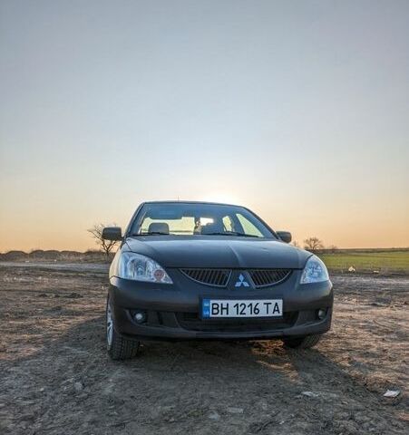 Черный Мицубиси Лансер, объемом двигателя 1.58 л и пробегом 362 тыс. км за 4600 $, фото 1 на Automoto.ua