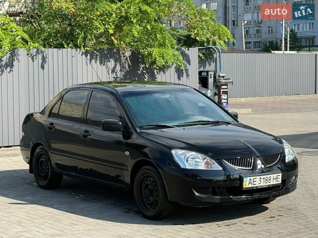 Чорний Міцубісі Lancer, об'ємом двигуна 1.58 л та пробігом 580 тис. км за 1700 $, фото 1 на Automoto.ua