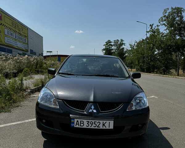 Чорний Міцубісі Lancer, об'ємом двигуна 1.58 л та пробігом 288 тис. км за 5500 $, фото 1 на Automoto.ua