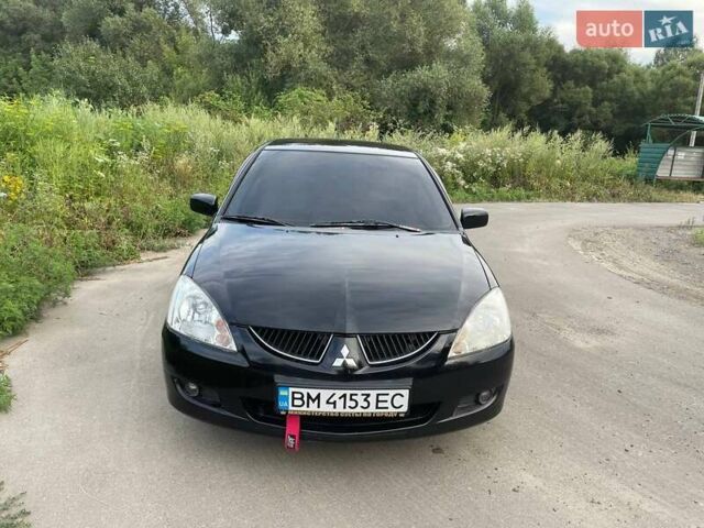 Черный Мицубиси Лансер, объемом двигателя 1.58 л и пробегом 172 тыс. км за 5700 $, фото 1 на Automoto.ua