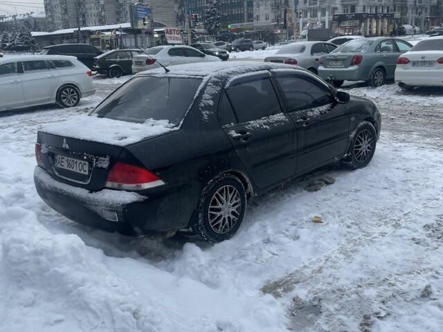 Черный Мицубиси Лансер, объемом двигателя 1.6 л и пробегом 2 тыс. км за 3300 $, фото 1 на Automoto.ua