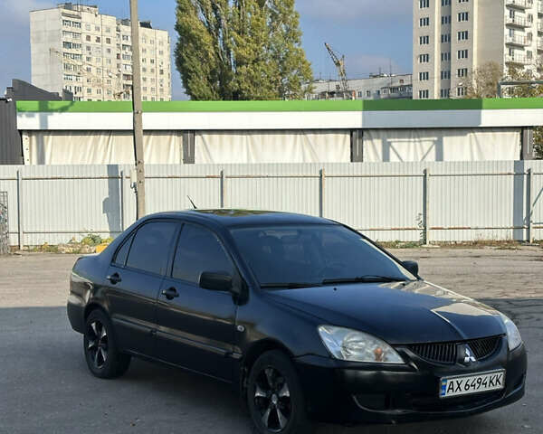 Мицубиси Лансер 2004 в Харькове на Automoto.ua Черный Мицубиси Лансер, объемом двигателя 1.58 л и пробегом 230 тыс. км за 2899 $, фото 1 на Automoto.ua