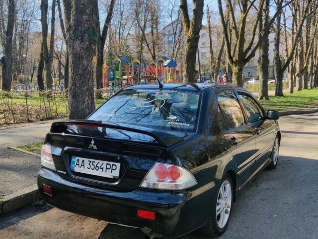 Черный Мицубиси Лансер, объемом двигателя 2 л и пробегом 220 тыс. км за 4400 $, фото 1 на Automoto.ua