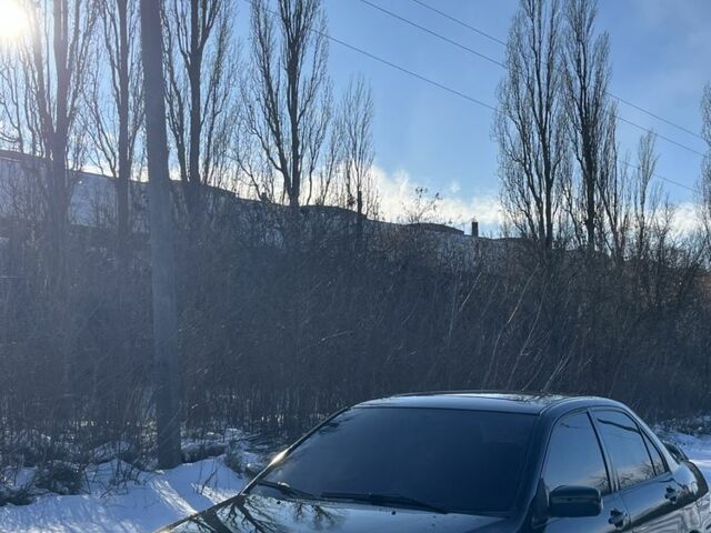 Чорний Міцубісі Lancer, об'ємом двигуна 2 л та пробігом 295 тис. км за 3600 $, фото 1 на Automoto.ua