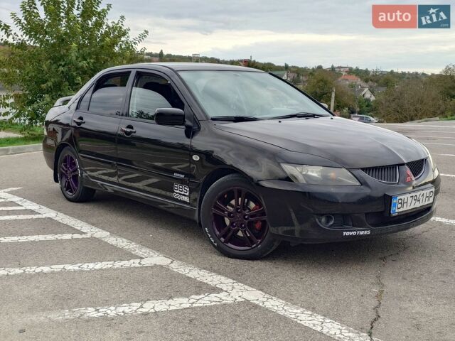 Чорний Міцубісі Lancer, об'ємом двигуна 2 л та пробігом 220 тис. км за 4600 $, фото 1 на Automoto.ua