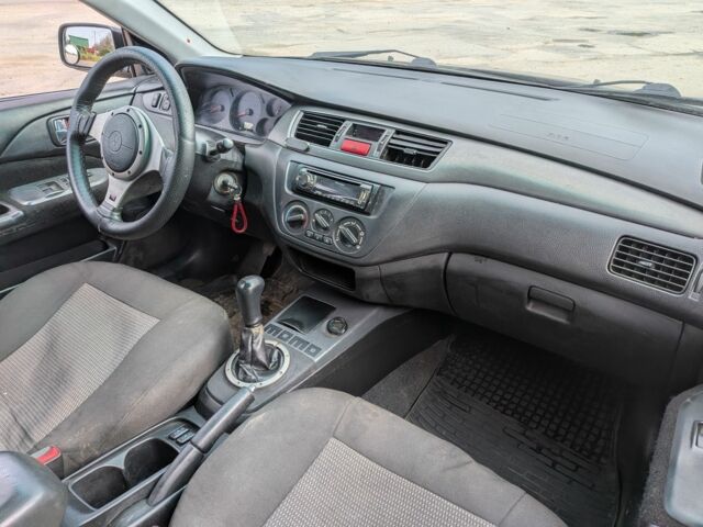 Чорний Міцубісі Lancer, об'ємом двигуна 2 л та пробігом 200 тис. км за 500 $, фото 1 на Automoto.ua