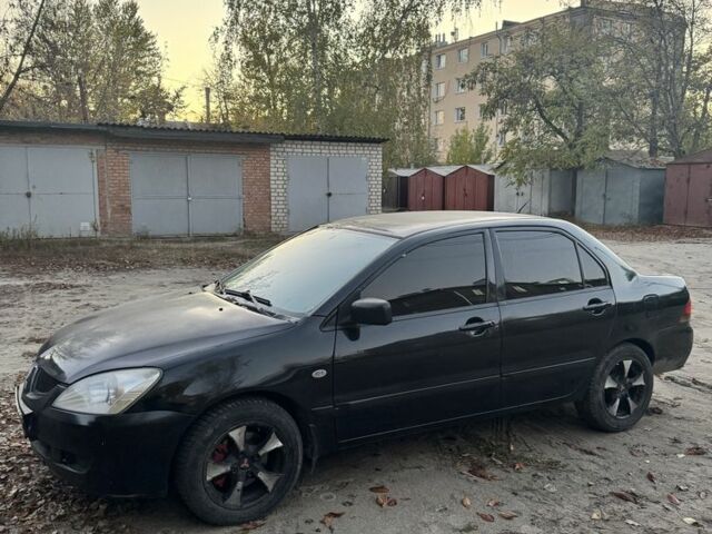 Мицубиси Лансер 2004 в Ивано-Франковске на Automoto.ua Черный Мицубиси Лансер, объемом двигателя 1.6 л и пробегом 280 тыс. км за 2500 $, фото 1 на Automoto.ua