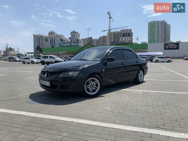 Черный Мицубиси Лансер, объемом двигателя 2 л и пробегом 286 тыс. км за 5900 $, фото 1 на Automoto.ua