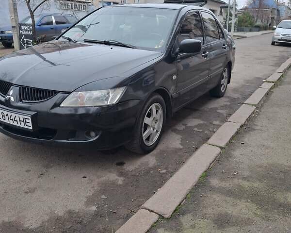Чорний Міцубісі Lancer, об'ємом двигуна 1.58 л та пробігом 230 тис. км за 3600 $, фото 1 на Automoto.ua