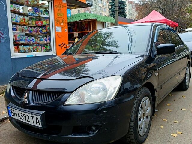 Чорний Міцубісі Lancer, об'ємом двигуна 1.6 л та пробігом 345 тис. км за 4800 $, фото 1 на Automoto.ua