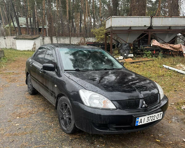 Черный Мицубиси Лансер, объемом двигателя 1.58 л и пробегом 264 тыс. км за 4600 $, фото 1 на Automoto.ua