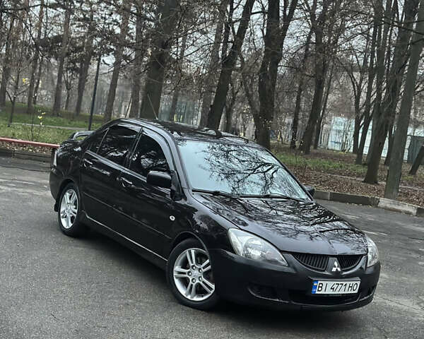 Чорний Міцубісі Lancer, об'ємом двигуна 2 л та пробігом 250 тис. км за 3999 $, фото 1 на Automoto.ua