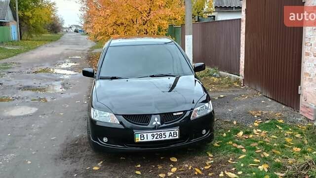 Черный Мицубиси Лансер, объемом двигателя 1.58 л и пробегом 261 тыс. км за 4400 $, фото 1 на Automoto.ua