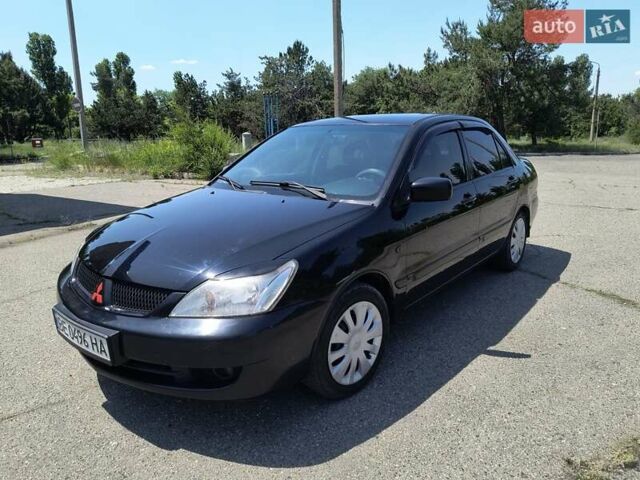 Черный Мицубиси Лансер, объемом двигателя 1.58 л и пробегом 352 тыс. км за 4000 $, фото 1 на Automoto.ua