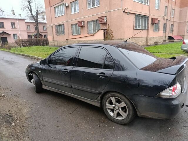 Черный Мицубиси Лансер, объемом двигателя 2 л и пробегом 275 тыс. км за 2599 $, фото 1 на Automoto.ua