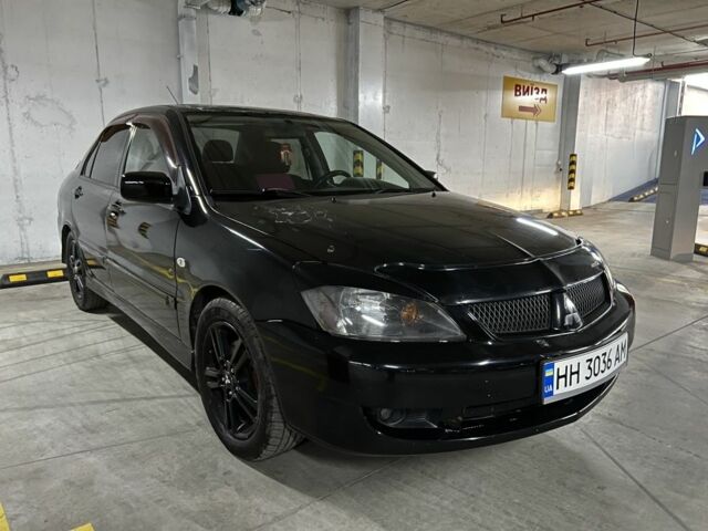 Чорний Міцубісі Lancer, об'ємом двигуна 2 л та пробігом 261 тис. км за 2700 $, фото 1 на Automoto.ua