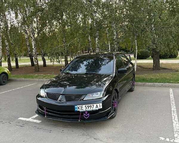 Чорний Міцубісі Lancer, об'ємом двигуна 2 л та пробігом 342 тис. км за 5000 $, фото 1 на Automoto.ua