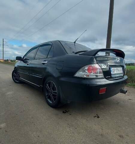 Черный Мицубиси Лансер, объемом двигателя 2 л и пробегом 225 тыс. км за 4400 $, фото 1 на Automoto.ua